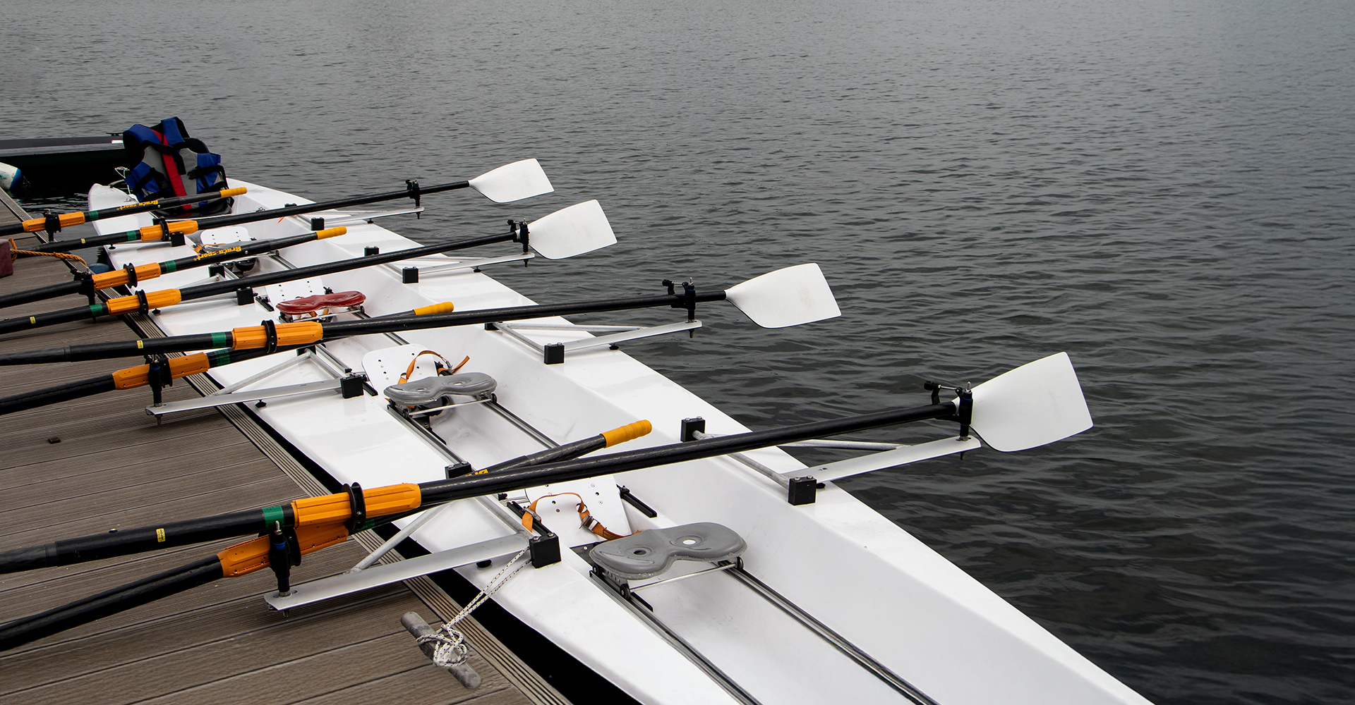 Rowing shell tied up at the dock
